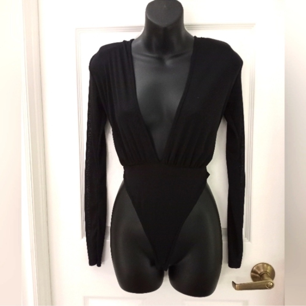 Elegant pretty little think black Long Sleeve Bodysuit size 4